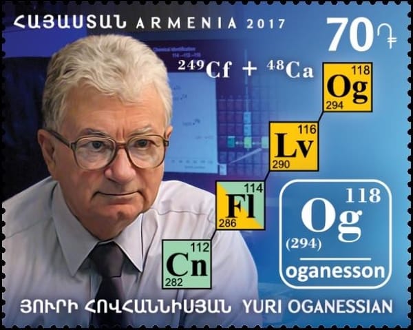Photo of an Armenian stamp featuring a white-haired man in shirt and tie and the periodic table entry for oganesson