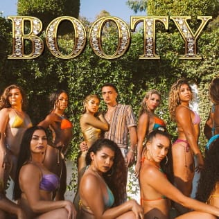 Photo of numerous bikini-clad women posing with a man; the word “Booty” appears at the top in large letters