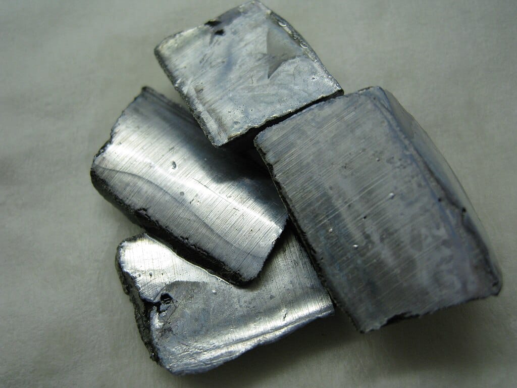 Cut pieces of a silvery-white metal