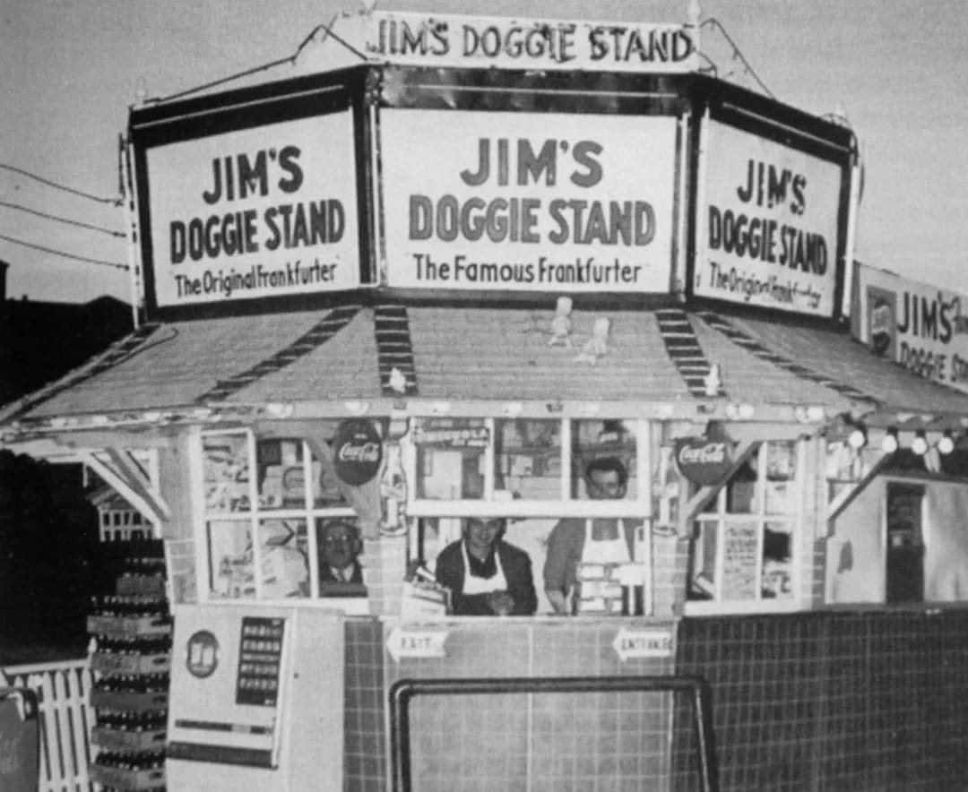 Black-and-white photo of a roadside hot dog stand