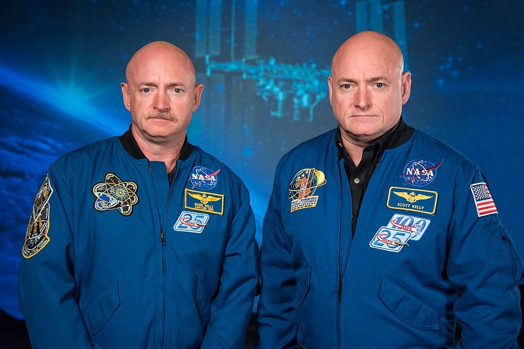 Photo of a pair of identical twins wearing NASA jackets