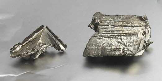 Photo of chunks of metal with a yellowish cast