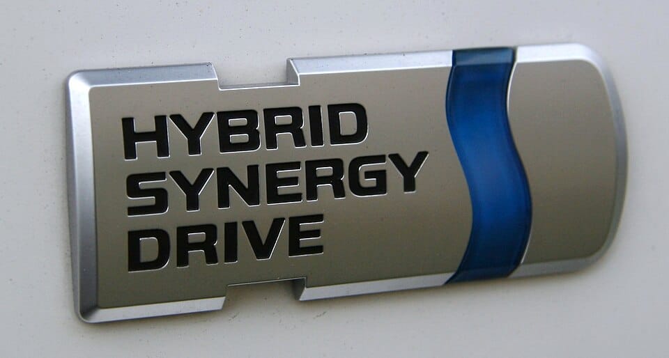 Automobile logo reading “Hybrid Synergy Drive”